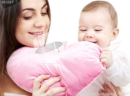 Image of baby and mama with heart-shaped pillow