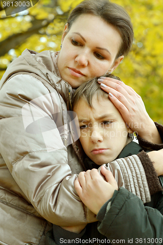 Image of Sad mother with son 