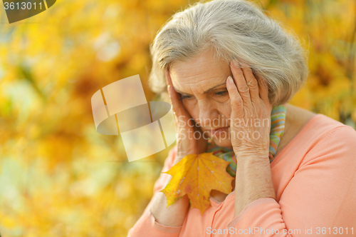 Image of thinking senior woman
