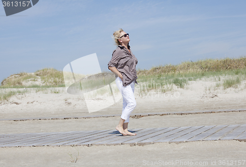 Image of Vacationer away on beach