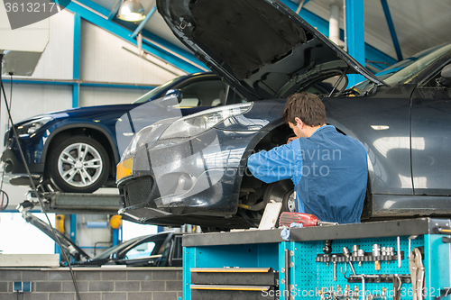 Image of Mechanic at work in a garage