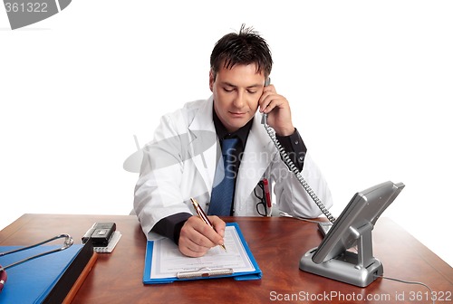 Image of Doctor filling out patient record