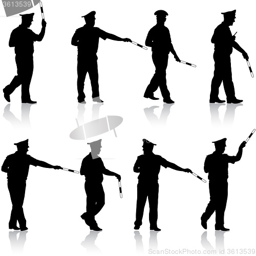 Image of Set black silhouettes  Police officer  with a rod on white 