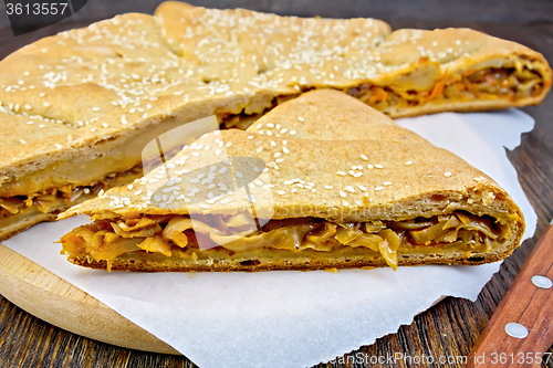 Image of Pie with cabbage and sesame on board