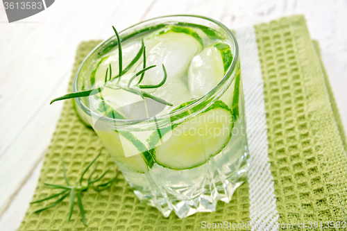 Image of Lemonade with cucumber and rosemary in glassful on board