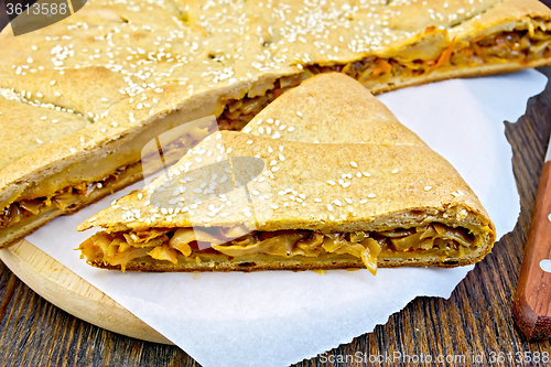 Image of Pie with cabbage and sesame on paper