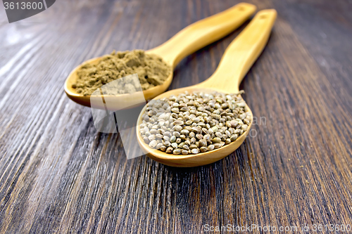 Image of Flour and seed of hemp in spoon on board