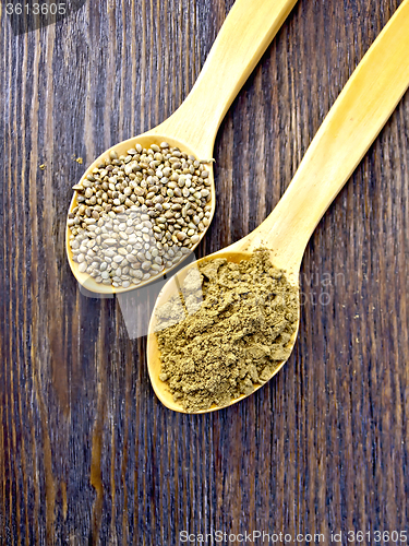 Image of Flour and seed of hemp in spoon on board top