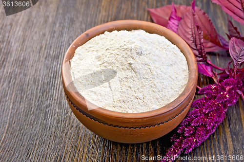 Image of Flour amaranth in clay bowl on board