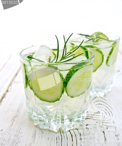 Image of Lemonade with cucumber and rosemary in two glassful on table