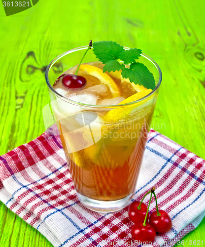 Image of Lemonade with cherry on green board