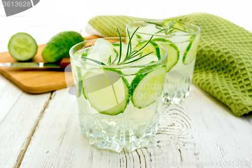 Image of Lemonade with cucumber and rosemary in two glassful on board