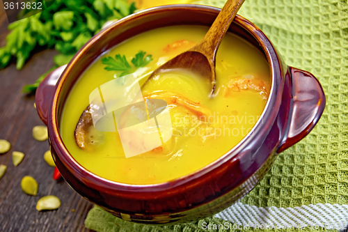 Image of Soup-puree pumpkin with prawns and mushrooms on napkin