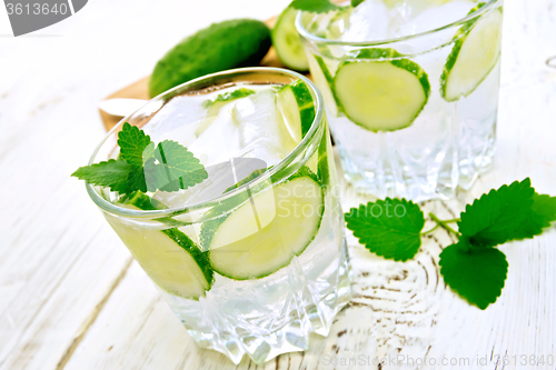 Image of Lemonade with cucumber and mint on white board