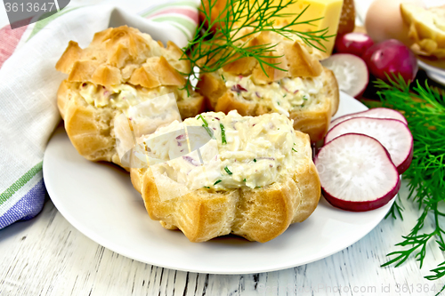Image of Appetizer of radish and cheese in profiteroles on plate