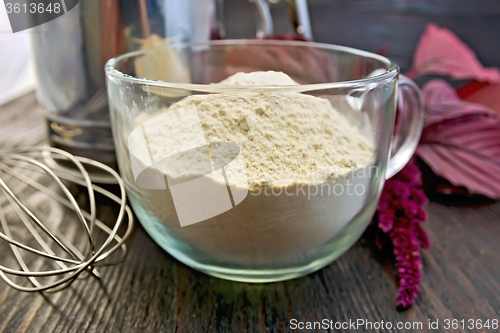 Image of Flour amaranth in glass cup with mixer on board