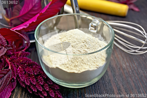 Image of Flour amaranth in glass cup with rolling pin on board