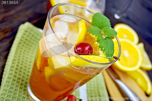 Image of Lemonade with cherry in glassful on board