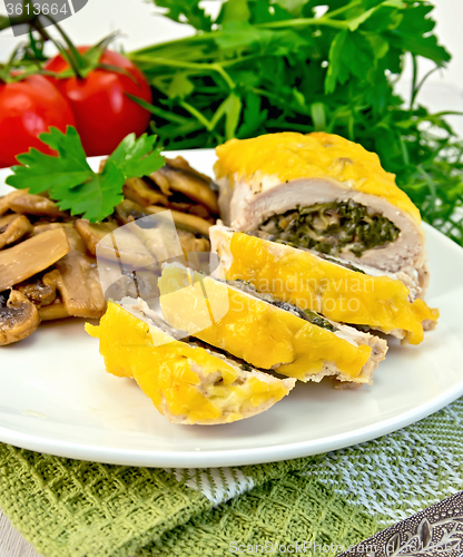 Image of Roll chicken with champignons on napkin