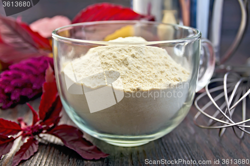 Image of Flour amaranth in glass cup on board