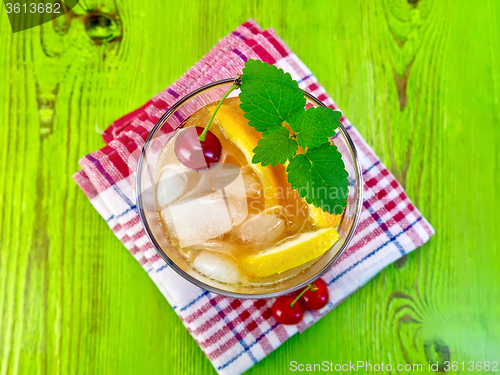 Image of Lemonade with cherry on green board top