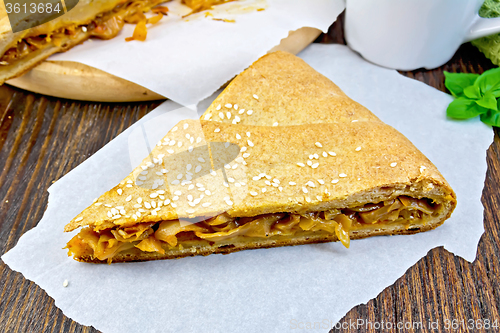 Image of Pie with cabbage and sesame on parchment