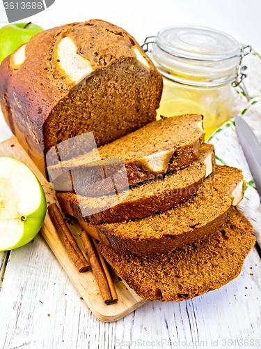 Image of Bread apple with honey on light board