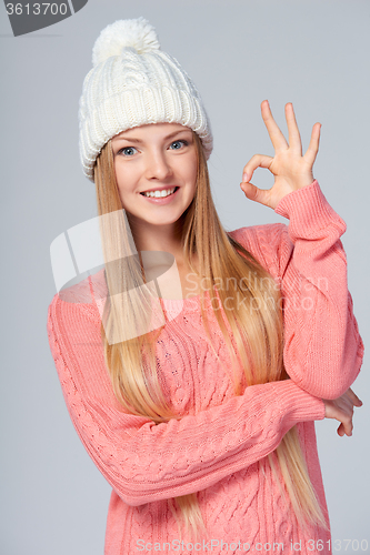 Image of Christmas girl gesturing OK sign