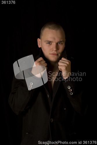 Image of The bald guy in a coat II