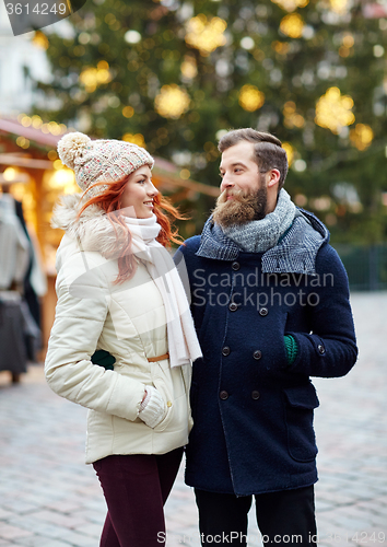 Image of happy couple walking in old town