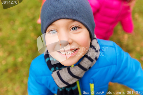 Image of happy little boy face outdoors