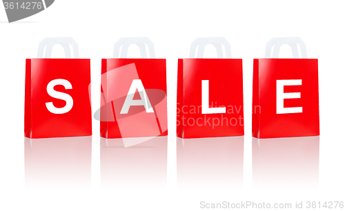 Image of many red shopping bags with sale word