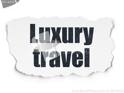 Image of Vacation concept: Luxury Travel on Torn Paper background