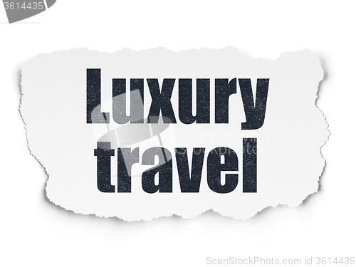 Image of Vacation concept: Luxury Travel on Torn Paper background