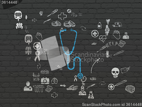 Image of Medicine concept: Stethoscope on wall background
