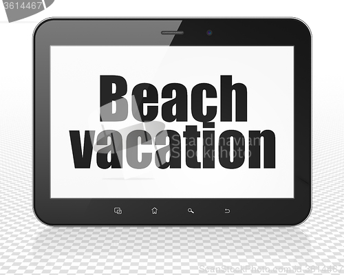 Image of Travel concept: Tablet Pc Computer with Beach Vacation on display
