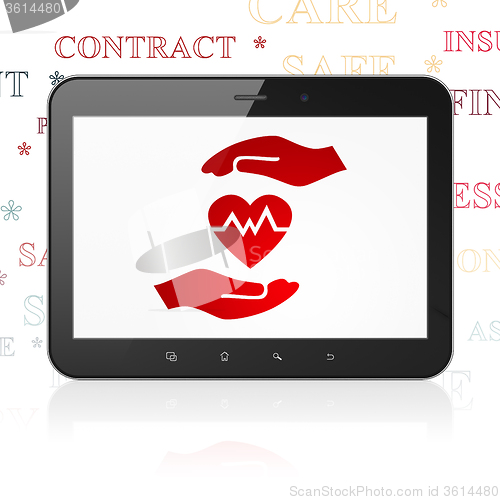 Image of Insurance concept: Tablet Computer with Heart And Palm on display