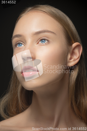 Image of Beautiful face of young woman with clean fresh skin close up