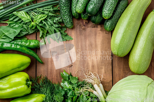 Image of The green vegetables on wooden table