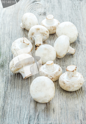 Image of The champignons on wooden background