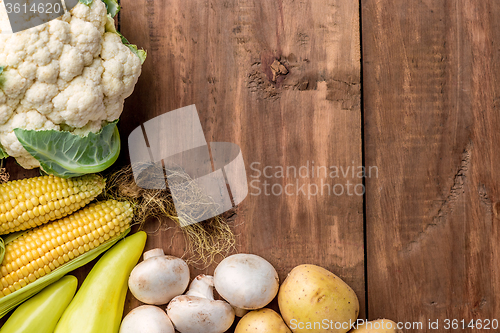 Image of The multicolored vegetables on wooden table