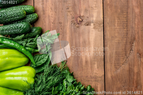 Image of The green vegetables on wooden table