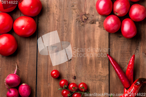 Image of The red vegetables on wooden table