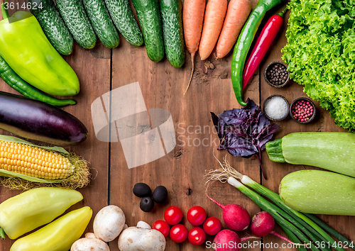 Image of The multicolored vegetables on wooden table