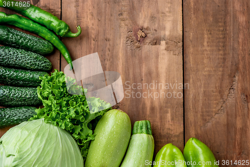 Image of The green vegetables on wooden table