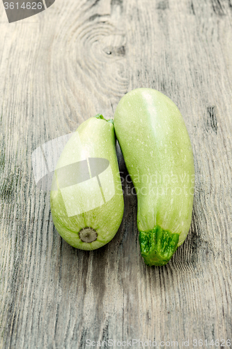Image of The two zucchini on wooden background