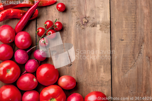 Image of The red vegetables on wooden table