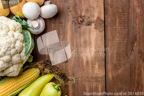 Image of The multicolored vegetables on wooden table