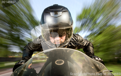 Image of Biker racing on the road