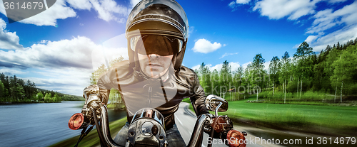 Image of Biker racing on the road